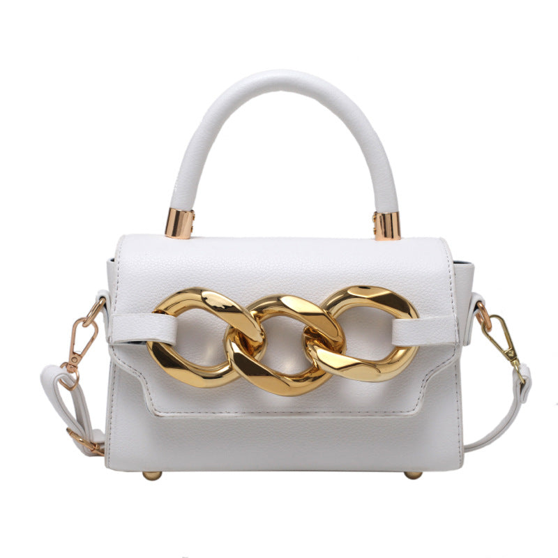 White and 2024 gold handbag